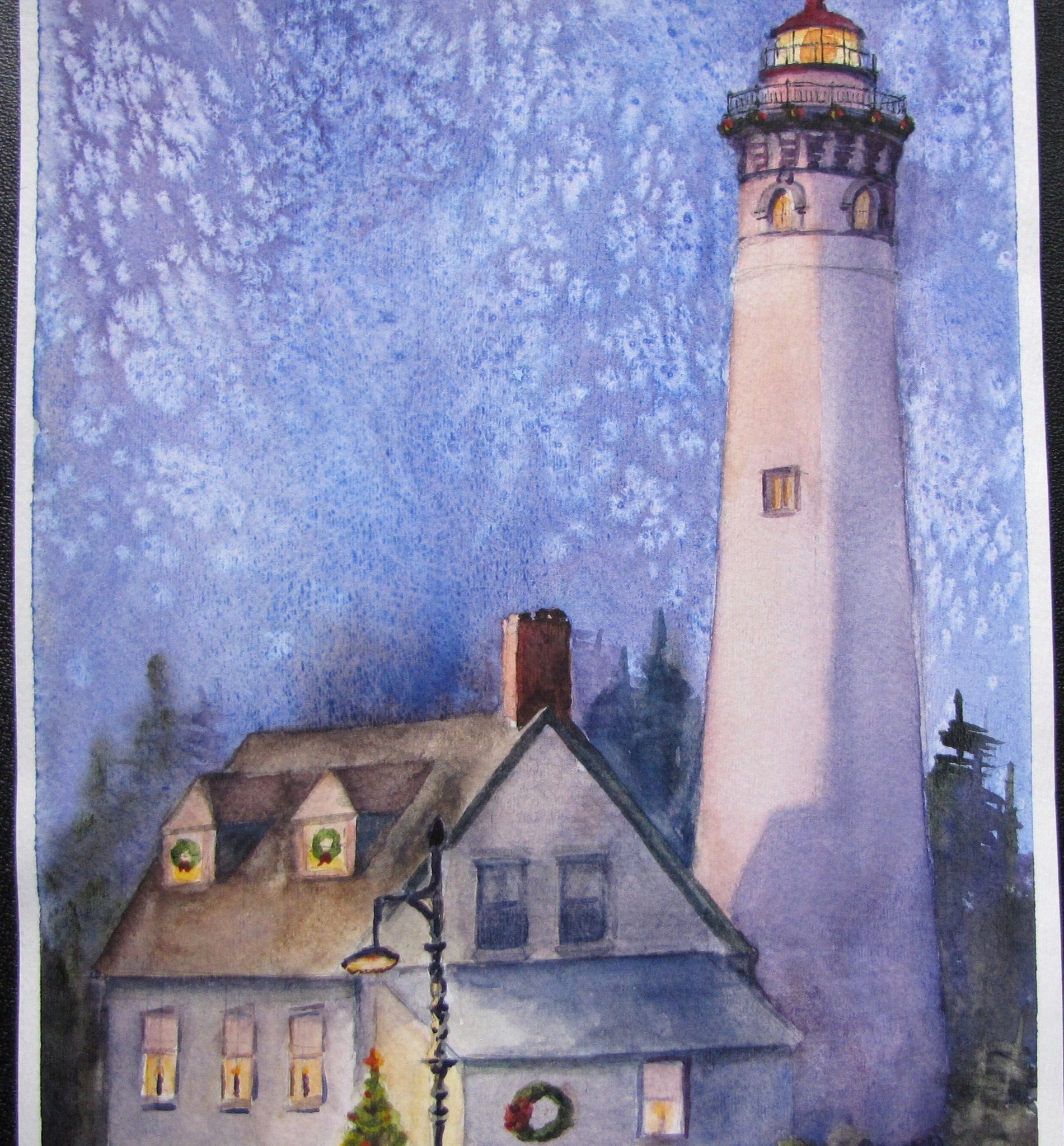 A watercolor painting of the New Presque Isle Lighthouse at Christmas, with a snowy landscape and a star-filled night sky.